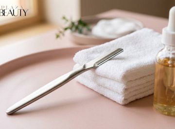 Skincare setup with towels, facial razor, and serum bottle — representing dermaplaning facial in Brisbane for smooth, radiant skin.